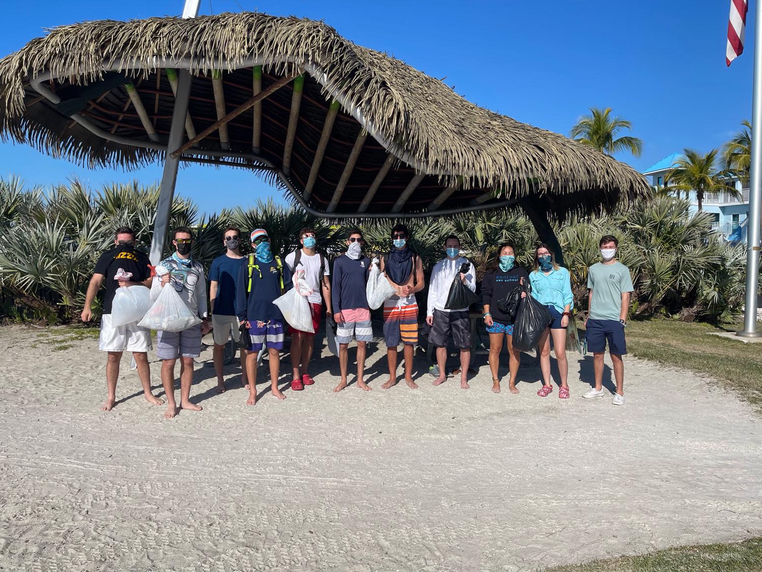 Pictured: Members of the Sailing Club with trash collected. Not Pictured are two other members of the club.