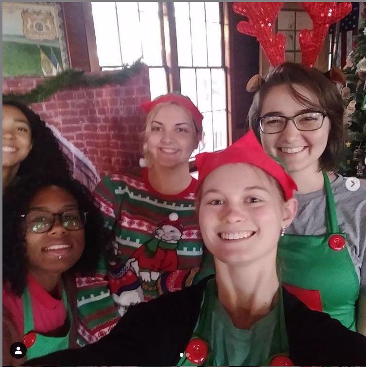 Some of our amazing team having a great time at the Holiday Bazaar.