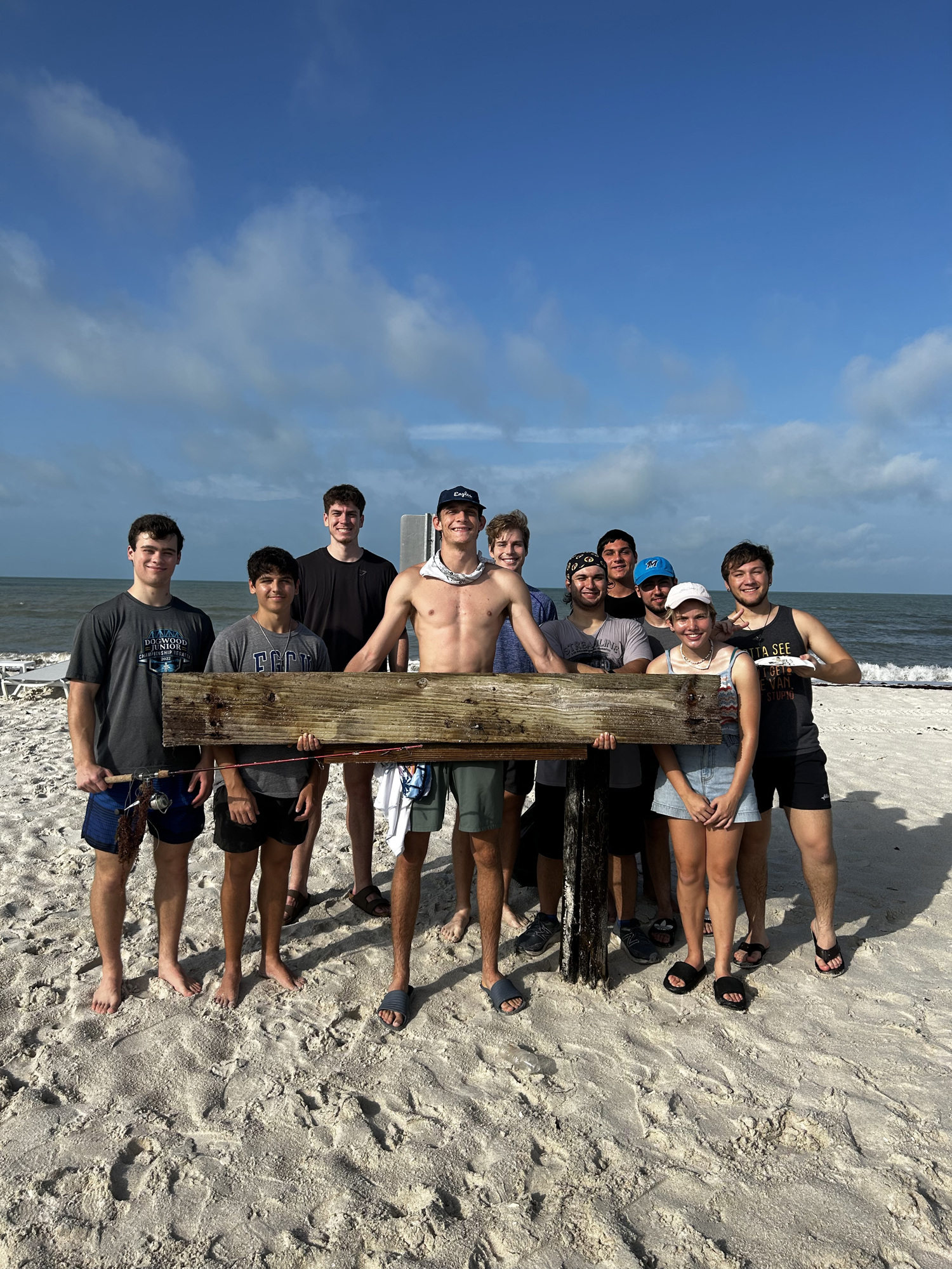 10 Club members holding trash at Bonita Beach