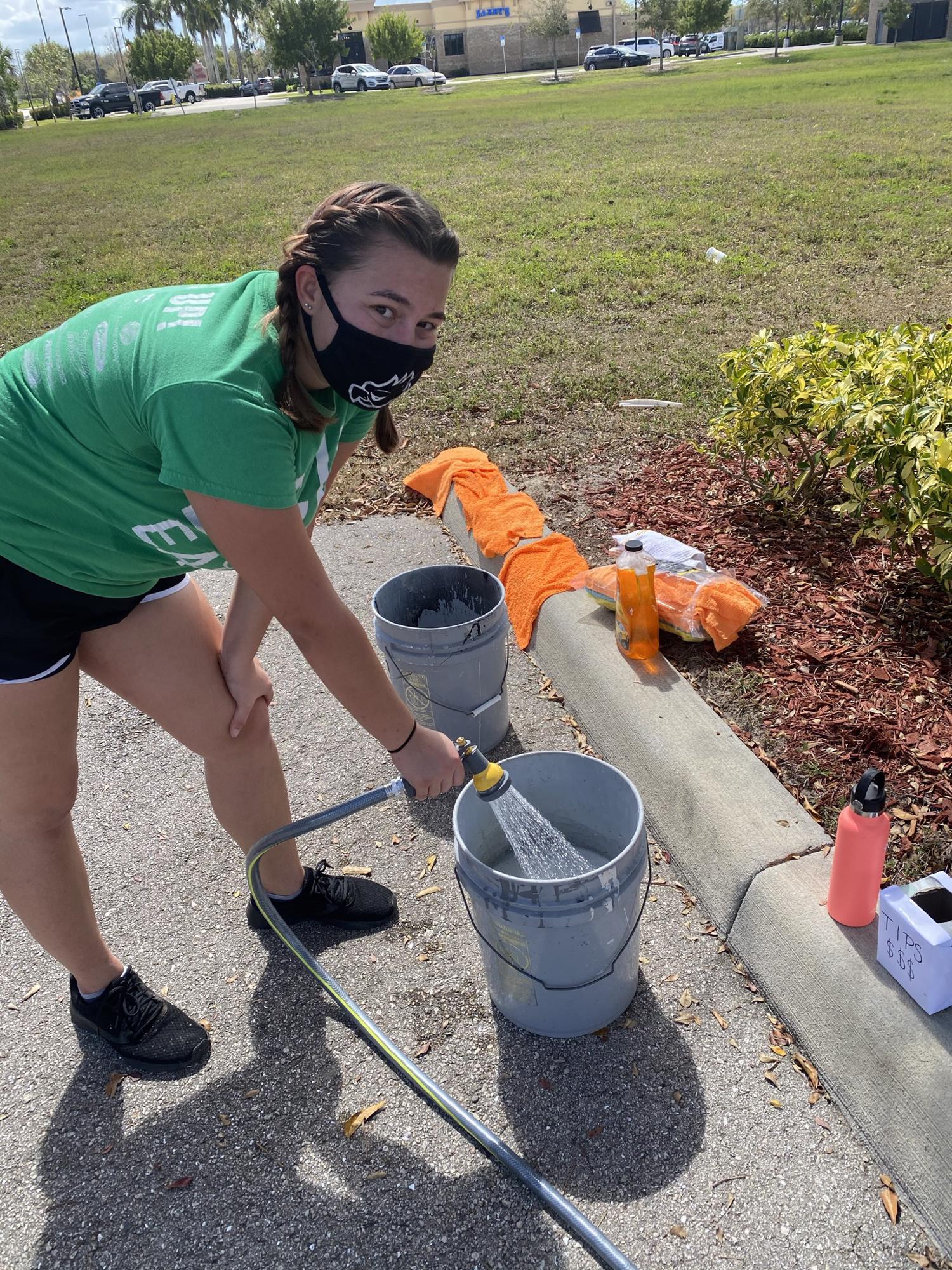 Sheyanne is filling up the bucket to get it ready for some customers!